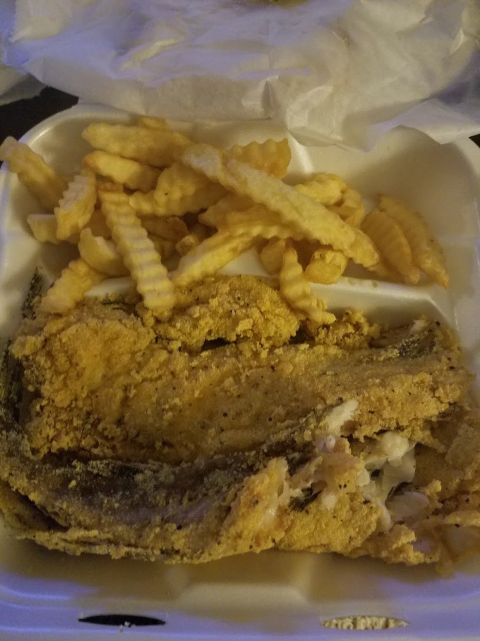 Restaurant menu featuring fish plates and hush puppies.